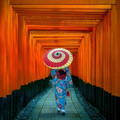 Asian women in traditional japanese kimonos at Fushimi Inari Shrine in Kyoto, Japan.